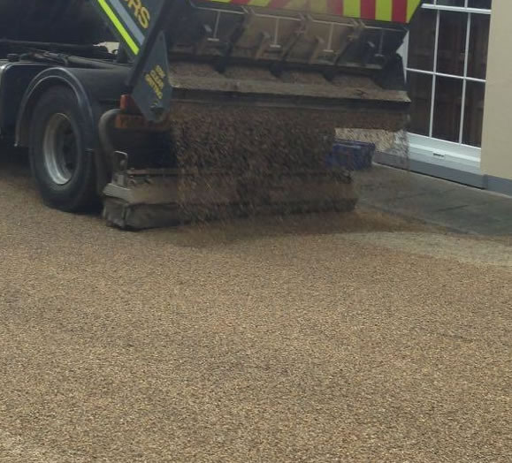 Tar and chip road surfacing in progress